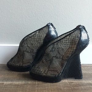 Christian Louboutin “Janet” wedge booties.
